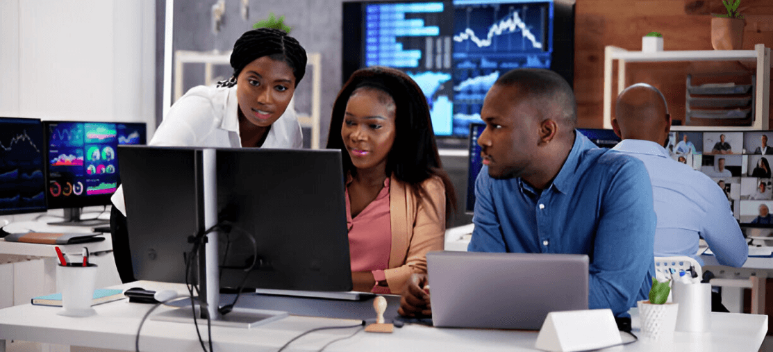 office workers looking at the monitor's screen